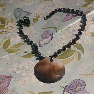 Elegant Black Beaded Necklace with Brown Pendant